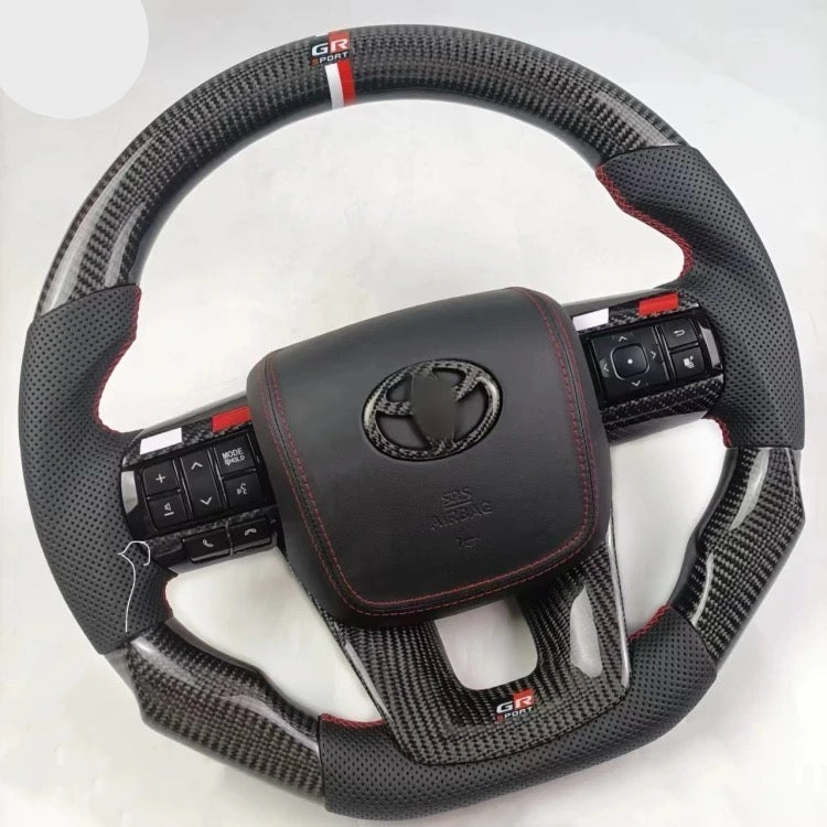 TOYOTA Hilux (2012-2024) - Carbon Fiber + Leather Steering Wheel