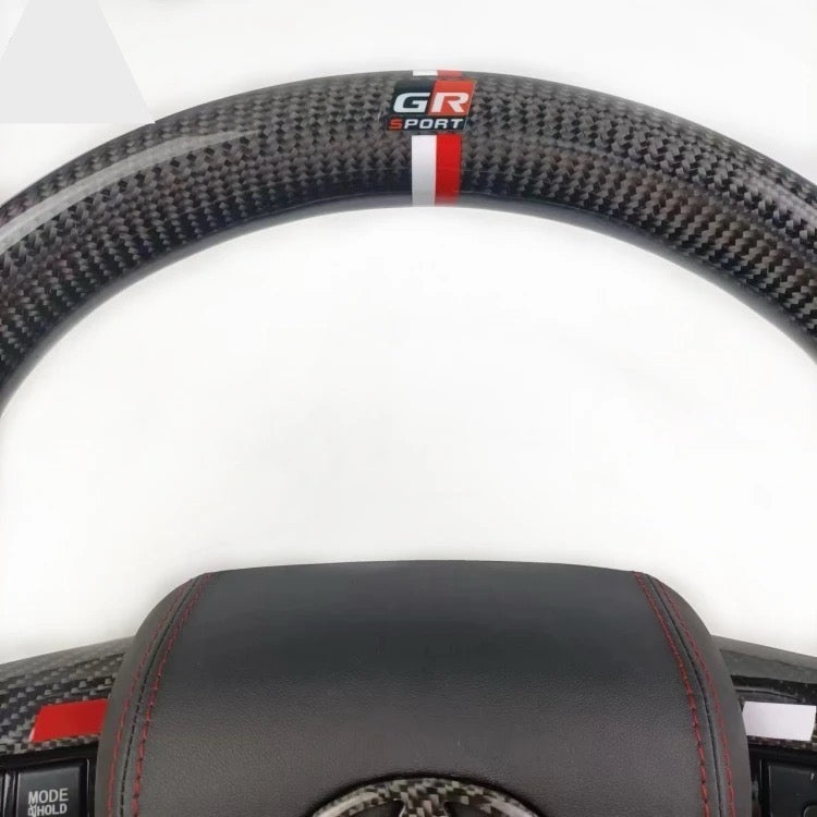 TOYOTA Hilux (2012-2024) - Carbon Fiber + Leather Steering Wheel