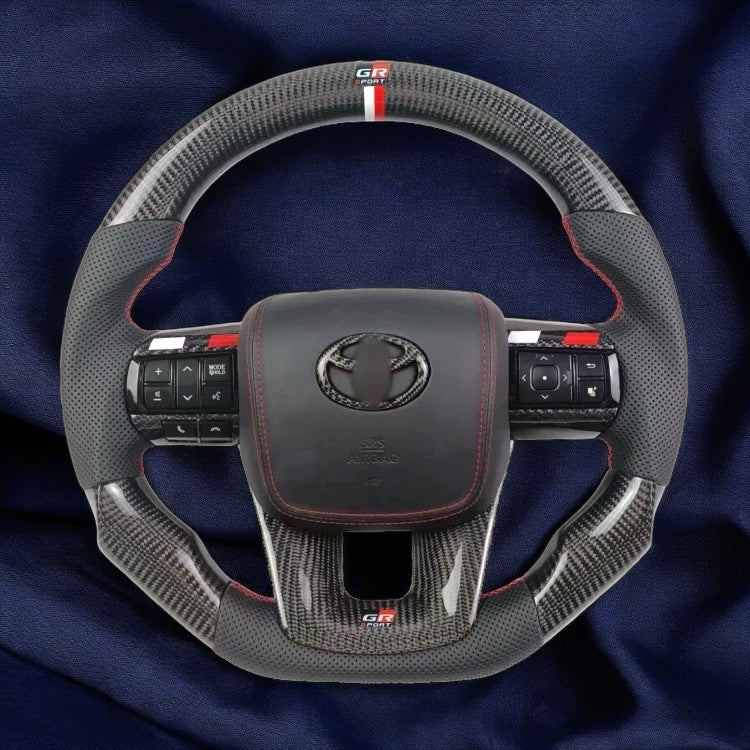 TOYOTA Hilux (2012-2024) - Carbon Fiber + Leather Steering Wheel