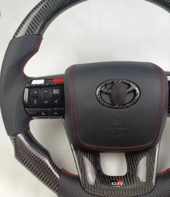 TOYOTA Hilux (2012-2024) - Carbon Fiber + Leather Steering Wheel